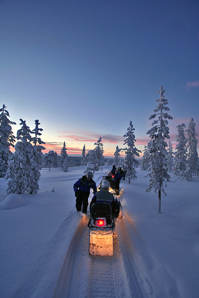 Driving a snowmobile through the Arctic wilderness