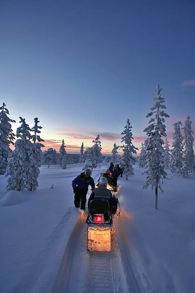 Driving a snowmobile through the Arctic wilderness