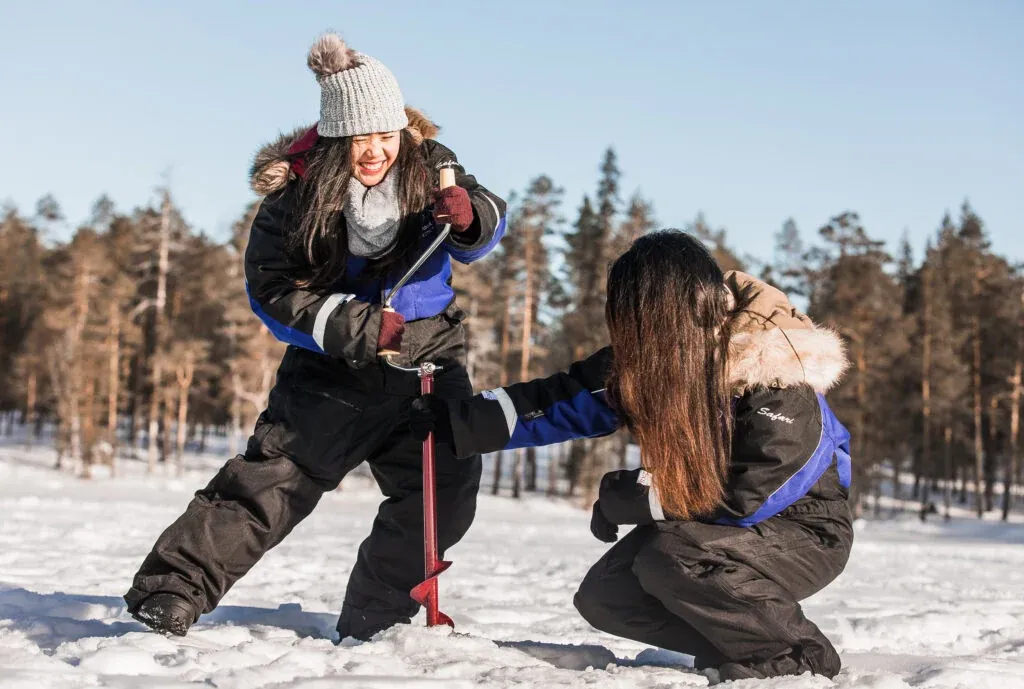 Drilling the hole into ice