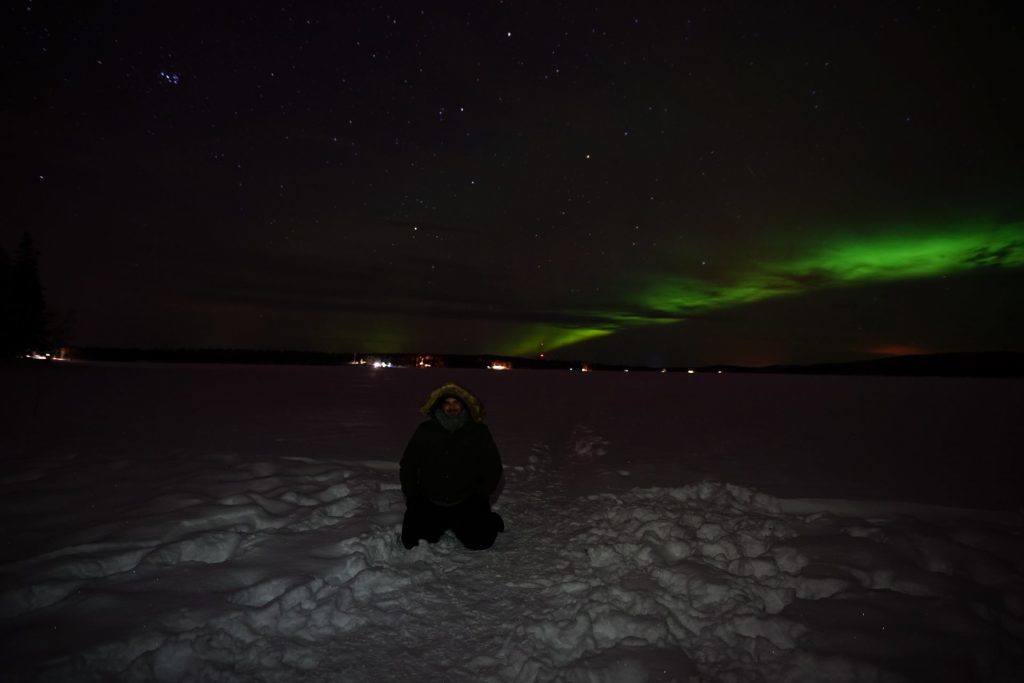 guest with aurora on the background
