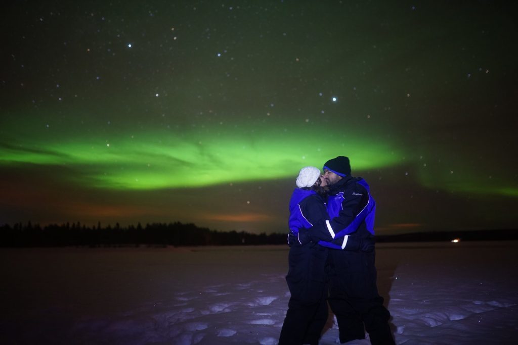 guests with aurora on the background