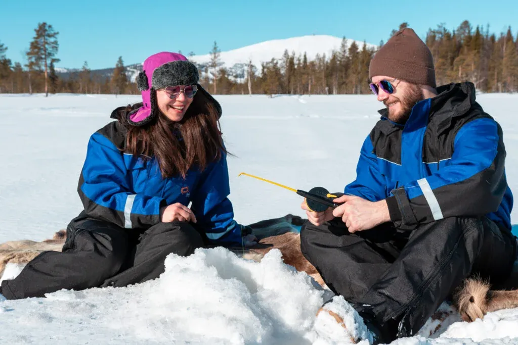 Snowmobile safari with ice fishing and outdoor lunch in Levi