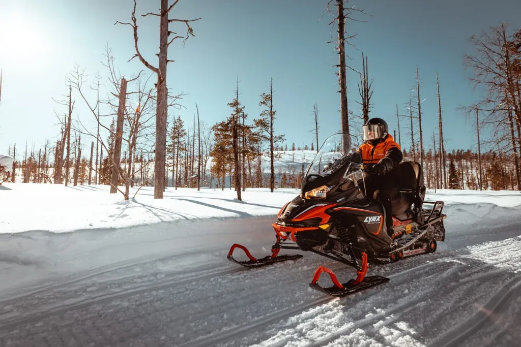 Snowmobile safari with ice fishing and outdoor lunch in Levi