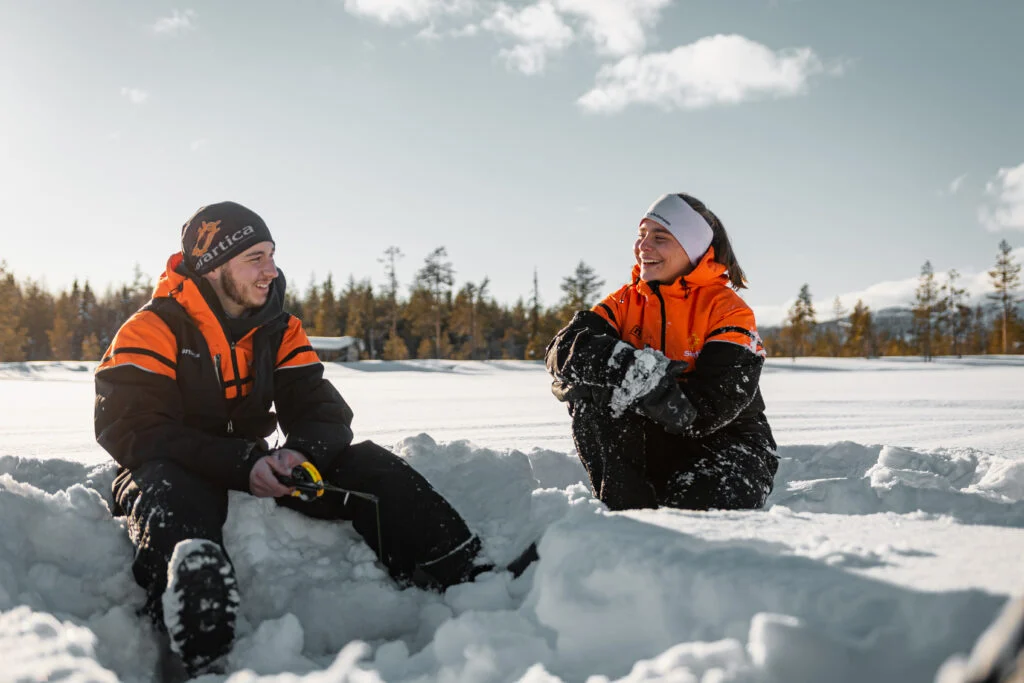 Snowmobile safari with ice fishing and outdoor lunch in Levi